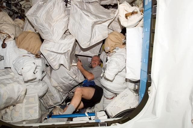 NASA image: Phillips in A/L Crewlock (C/L) compartment