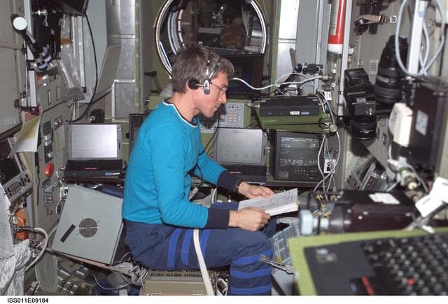 NASA image: Krikalev works with the TORU teleoperated control system in the SM during Expedition 11