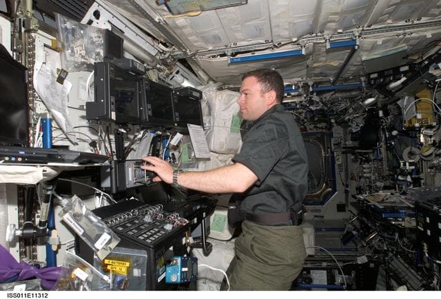 NASA image: Kelly at SSRMS controls in U.S. Laboratory