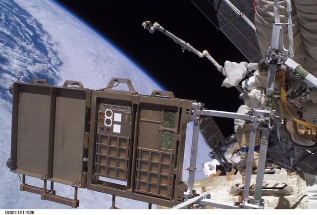 NASA image: MPAC/SEED panel being removed during EVA