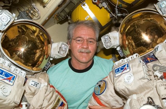 NASA image: Phillips with Orlan suit in DC1 airlock