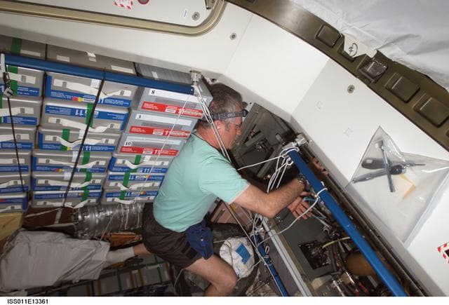 NASA image: Phillips removes Failed RPCM (Remote Power Controller Module)