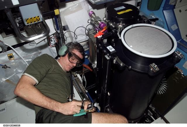 NASA image: McArthur conducts troubleshooting operations on the TCCS during Expedition 12