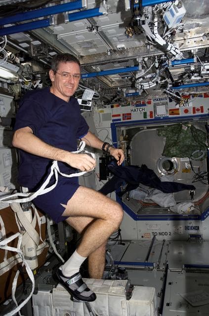 NASA image: McArthur exercises on the CEVIS on Expedition 12