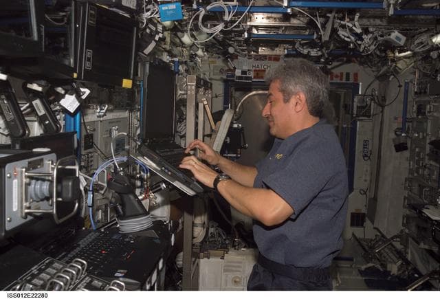 NASA image: Brazilian Astronaut Marcos Pontes uses a computer during Expedition 12/13 joint operations