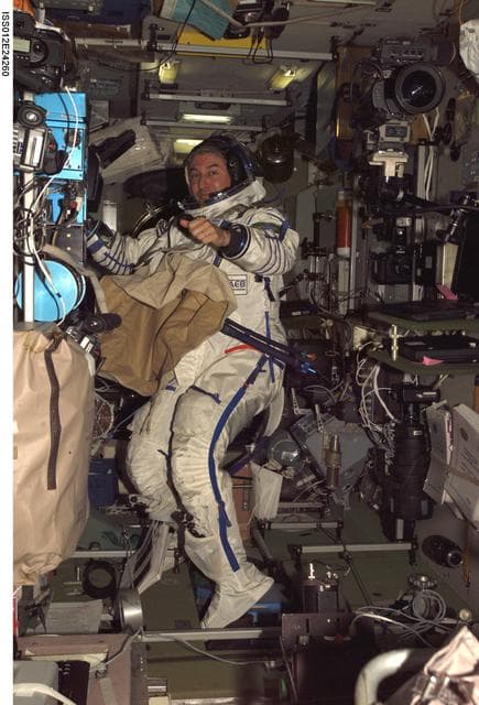 NASA image: Pontes, wearing a Sokol suit floats in the SM during Expedition 12/13 Joint Operations