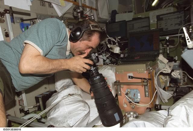NASA image: Vinogradov photographs at window in the SM during Expedition 13