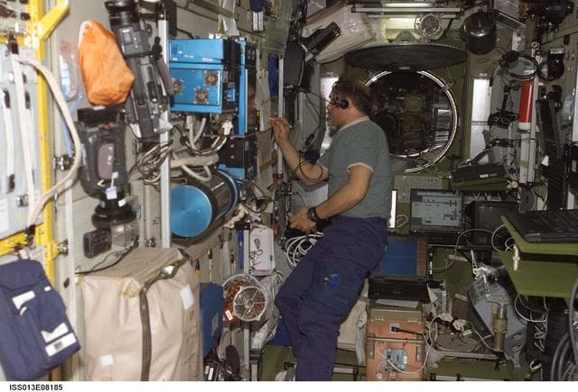 NASA image: Vinogradov makes notation on pad in the SM during Expedition 13