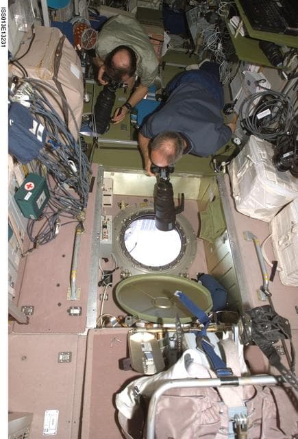 NASA image: Williams and Vinogradov take pictures in the SM during Expedition 13