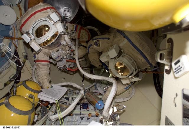 NASA image: Vinogradov wearing Russian Orlan Space Suit in the Pirs Docking Compartment (DC1) during Expedition 13