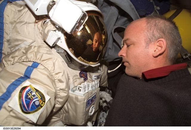 NASA image: Williams checks out the Russian Orlan Spacesuit in the Pirs Docking Compartment (DC1) during Expedition 13