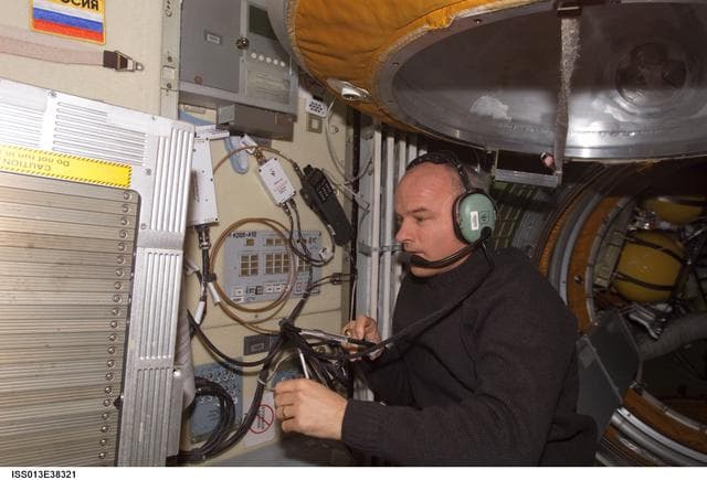 NASA image: Williams uses an amateur radio in the FGB during Expedition 13