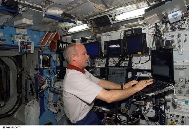 NASA image: Williams uses laptop computer in the U.S. Laboratory taken during Expedition 13