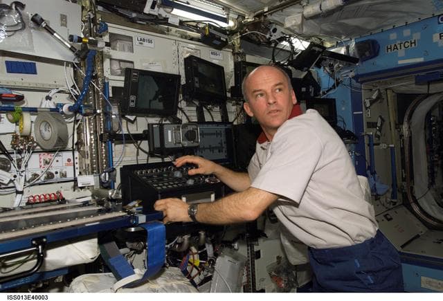 NASA image: Williams operates the SSRMS in the U.S. Laboratory taken during Expedition 13