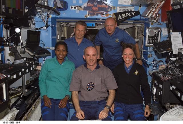 NASA image: Expedition 13 and STS-121 crew members work in the U.S. Lab during joint operations