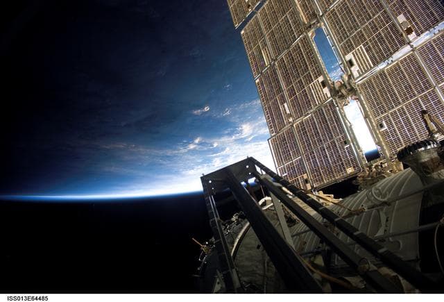 NASA image: Solar Array Panels and Earths Horizon during Expedition 13