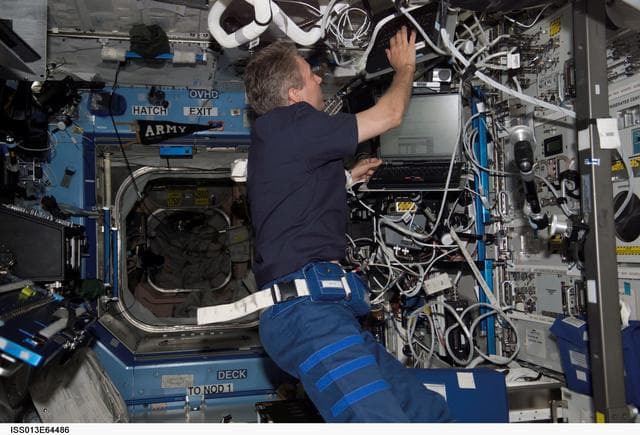 NASA image: Reiter working in the U.S. Laboratory during Expedition 13