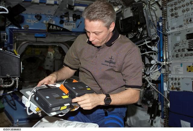 NASA image: Reiter packs Sony DVCAM and AVIU-CC VID Cable during Expedition 13