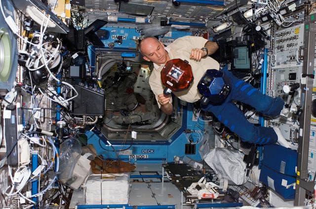 NASA image: Williams checks SPHERES in the U.S. Laboratory during Expedition 13