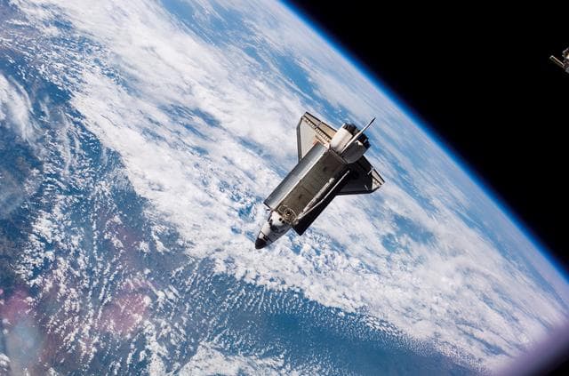 NASA image: View of Orbiter Atlantis after undocking from the ISS during Expedition 13