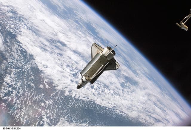 NASA image: View of Orbiter Atlantis after undocking from the ISS during Expedition 13