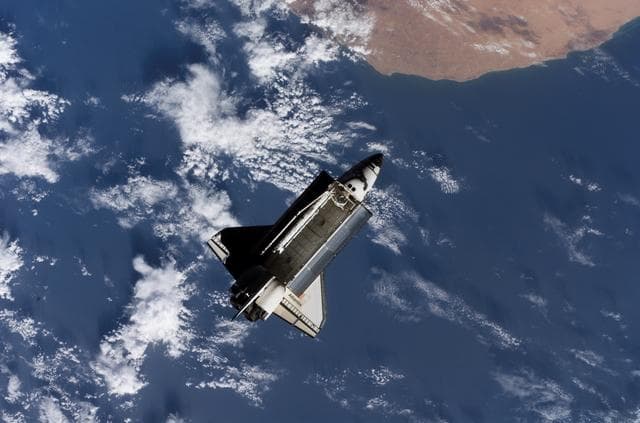 NASA image: View of Orbiter Atlantis after undocking from the ISS during Expedition 13