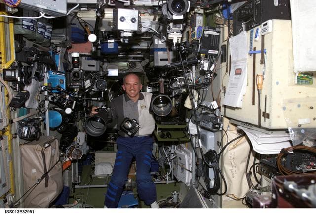 NASA image: Williams poses with Camera Equipment in the SM