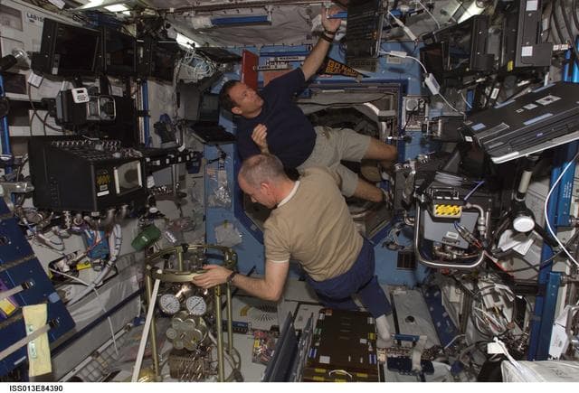 NASA image: Lopez-Alegria and Williams installing the FSS in the U.S. Laboratory