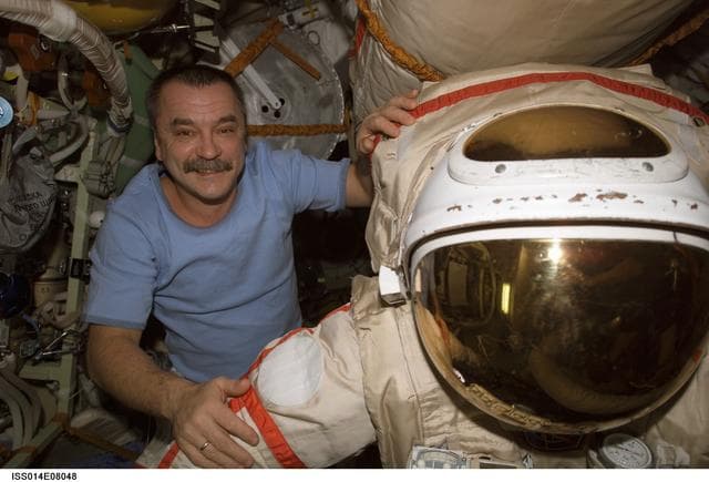 NASA image: Tyurin conducts ORLAN gear prep in DC1