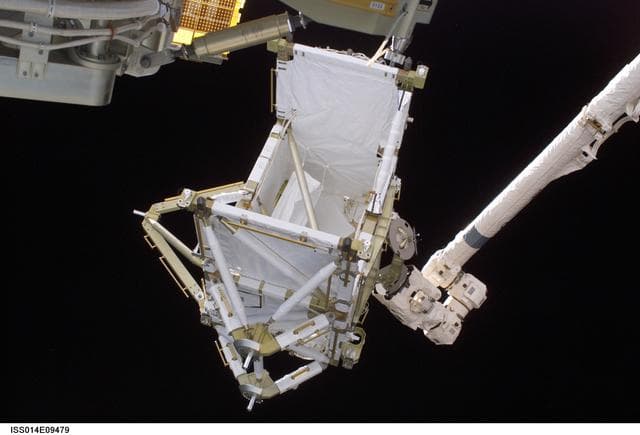 NASA image: P5 truss hand-off from Discoverys RMS robotic arm