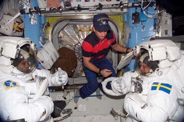NASA image: Curbeam and Fuglesang prepare for first EVA of mission