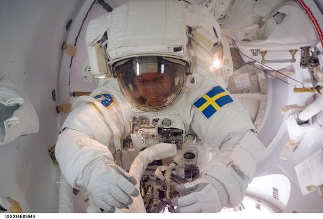 NASA image: Fuglesang in Airlock at the end of the first EVA of the mission