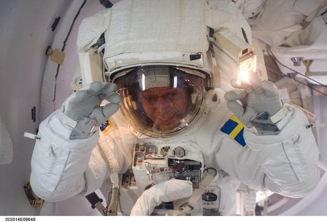 NASA image: Fuglesang in Airlock at the end of the first EVA of the mission