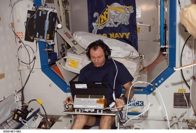 NASA image: Lopez-Alegria with TRAC experiment in Destiny laboratory