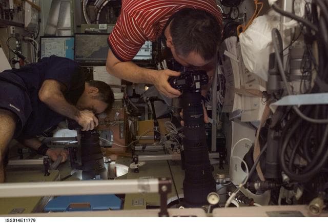 NASA image: Lopez-Alegria and Tyurin in Zvezda with cameras