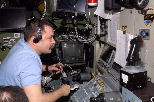 NASA image: Tyurin works with the TORU teleoperated control system in the SM during Expedition 14