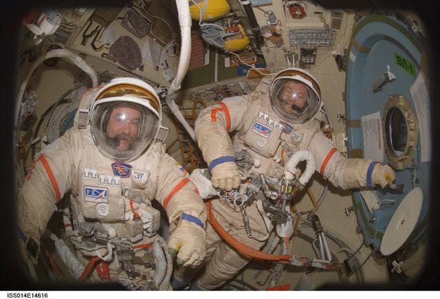 NASA image: Lopez-Alegria and Tyurin in Pirs prior to EVA 17A