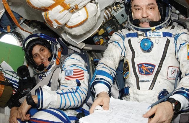 NASA image: Tyurin and Williams in Soyuz 13 spacecraft