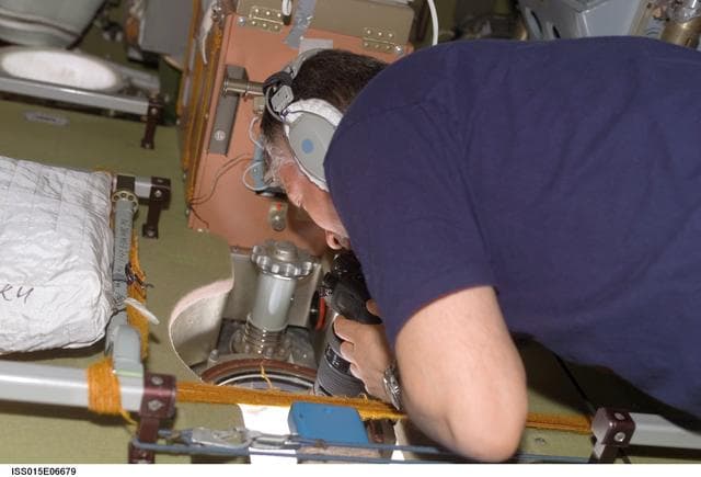 NASA image: Yurchikhin taking CEO Photos in the SM during Expedition 15