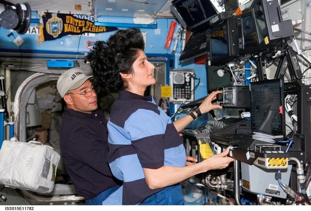 NASA image: Williams and Archambault working in the US Lab during Expedition 15/STS-117 Joint Operations