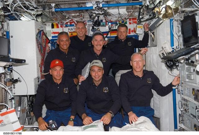 NASA image: STS-117 Crewmembers pose for a portrait in the US Lab Joint Operations