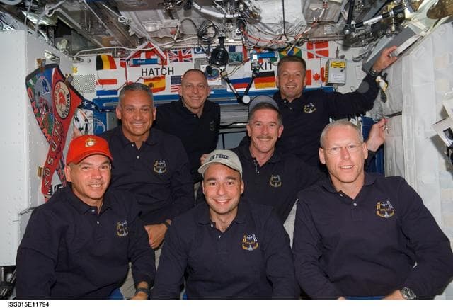 NASA image: STS-117 Crewmembers pose for a portrait in the US Lab Joint Operations
