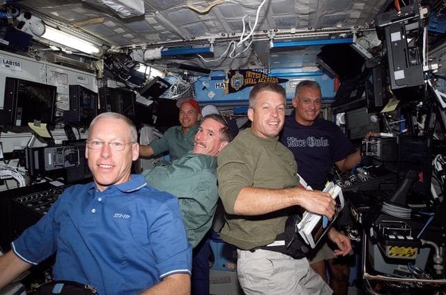 NASA image: STS-117 Crew working in the US Lab during Expedition 15/STS-117 Joint Operations