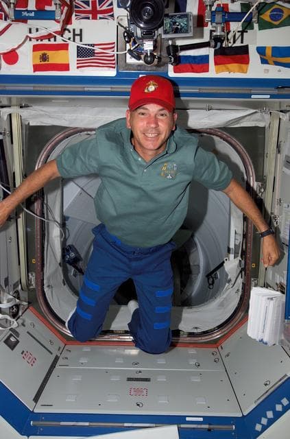 NASA image: Archambault poses for a photo in the U.S. Laboratory during STS-117/Expedition 15 Joint Operations