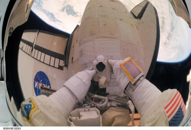NASA image: View of Olivas during an EVA to repair damage to the STS-117 OMS Pod