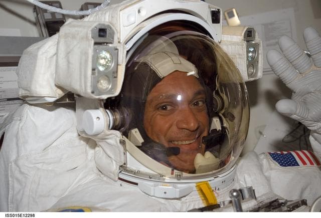 NASA image: View of Olivas preparing for EVA3 in the A/L during STS-117/Expedition 15 Joint Operations