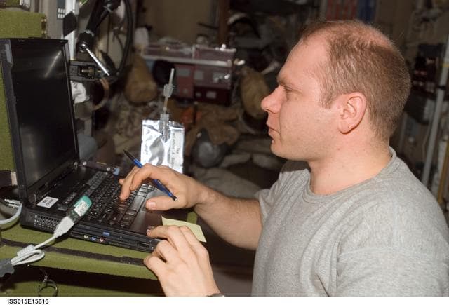 NASA image: Kotov works at a Computer Workstation during Expedition 15