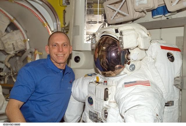 NASA image: View of Anderson posing with an EMU in the A/L during Expedition 15