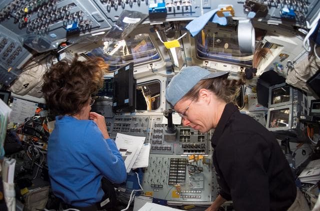 NASA image: Morgan and Caldwell work in the aft FD during STS-118