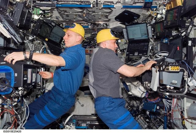 NASA image: View of Anderson and Yurchikhin working in the US Lab during Expedition 15